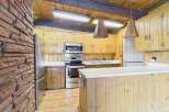 Step into this charming kitchen featuring a unique blend of rustic and modern elements.