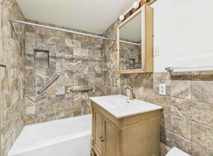 This bathroom features a stylish combination of functionality and design.