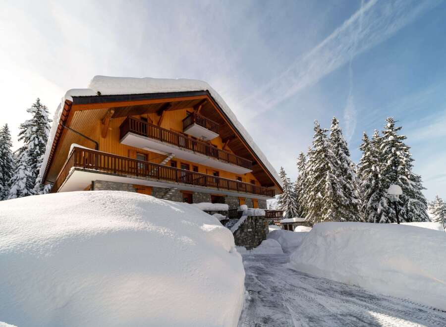 Experience the charm of this stunning chalet nestled in a winter wonderland.