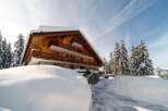 Experience the charm of this stunning chalet nestled in a winter wonderland.
