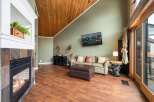 Step into this inviting living space, featuring a cozy fireplace and a stylish, modern design.