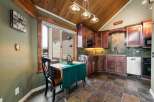 This charming kitchen boasts a warm and inviting atmosphere, perfect for culinary creations and casual dining.