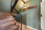 Step into this inviting home and be greeted by a charming staircase.