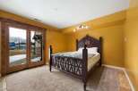 This stunning bedroom boasts a unique design with a beautiful wooden bed frame.