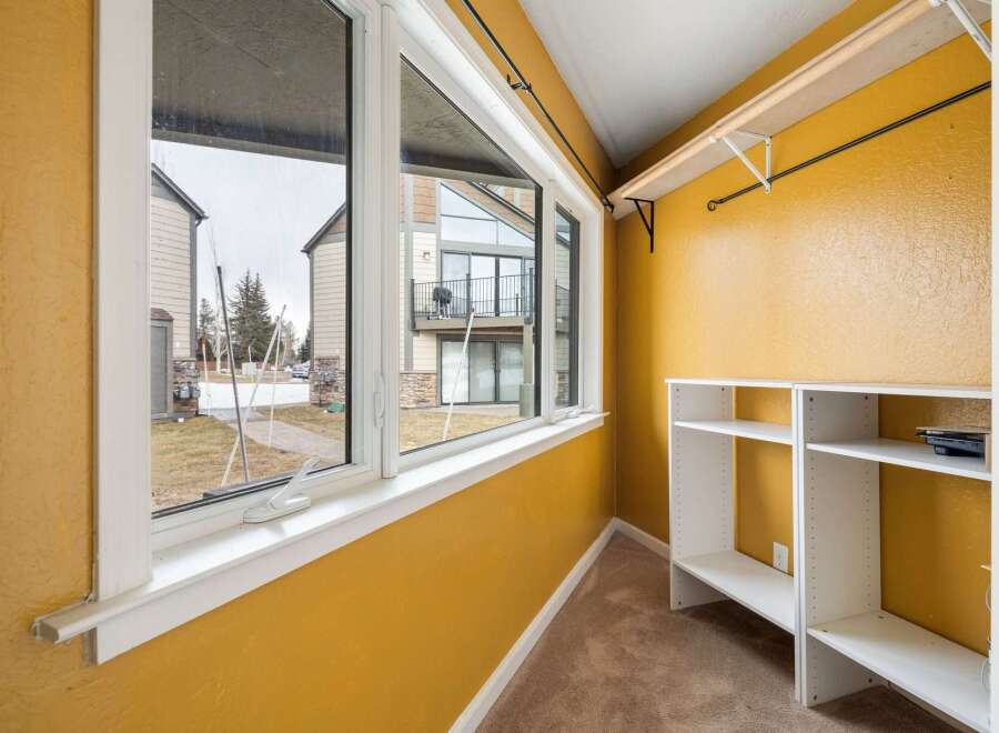 Step into this inviting space, bathed in natural light from the expansive windows.