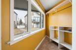 Step into this inviting space, bathed in natural light from the expansive windows.