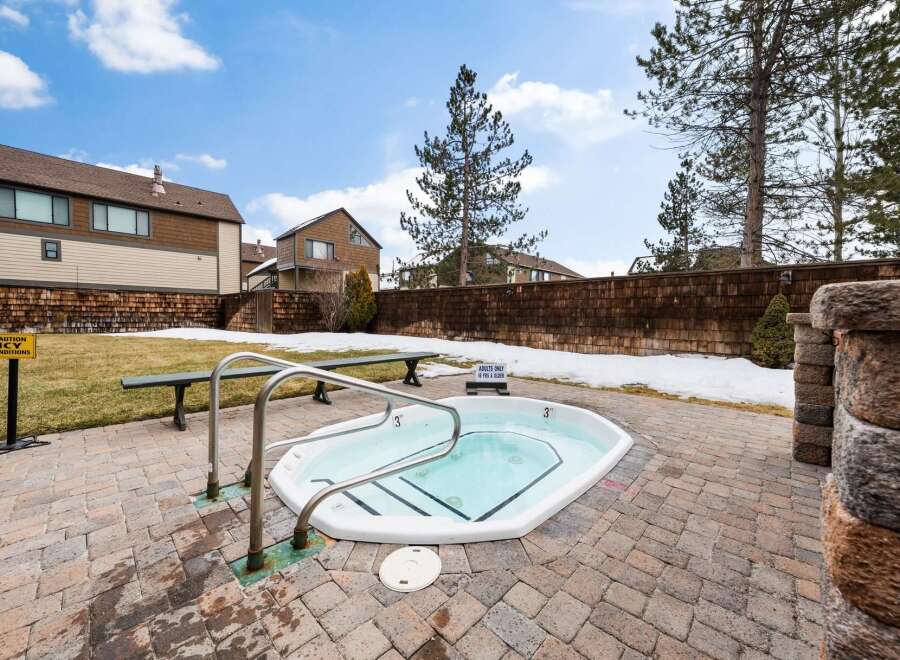 Enjoy a relaxing soak in this inviting hot tub, perfect for unwinding after a long day.