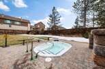 Enjoy a relaxing soak in this inviting hot tub, perfect for unwinding after a long day.