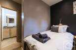 Discover the charm of this cozy bedroom, perfect for a relaxing getaway.