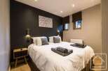 Discover the epitome of comfort in this stylish bedroom.