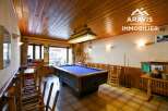 Step into this inviting space featuring a classic pool table, perfect for entertaining or relaxing.