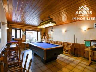 Step into this inviting space featuring a classic pool table, perfect for entertaining or relaxing.