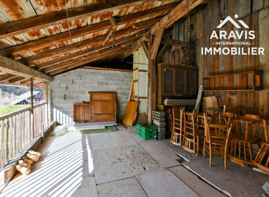 Discover the charm of this unique property, featuring rustic wooden beams and a spacious interior.