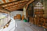 Discover the charm of this unique property, featuring rustic wooden beams and a spacious interior.