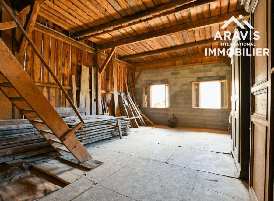 Discover the rustic charm of this unique property, featuring exposed wooden beams and a spacious interior.