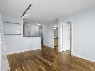 Step into modern elegance with this stunning property featuring beautiful hardwood floors and a bright, open layout.