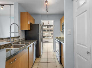 This stunning kitchen boasts modern appliances and ample counter space, perfect for culinary enthusiasts.