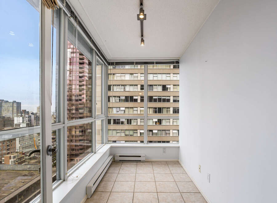 This stunning property boasts panoramic city views from its expansive windows, offering a bright and airy living space.