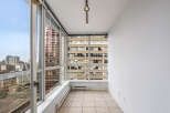 This stunning property boasts panoramic city views from its expansive windows, offering a bright and airy living space.