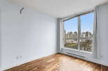 Experience urban living at its finest in this stunning apartment! This bright and airy space boasts beautiful hardwood floors, large windows with city views, and a modern design.
