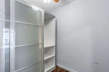 Discover the elegance of this modern closet, perfect for organizing your belongings.