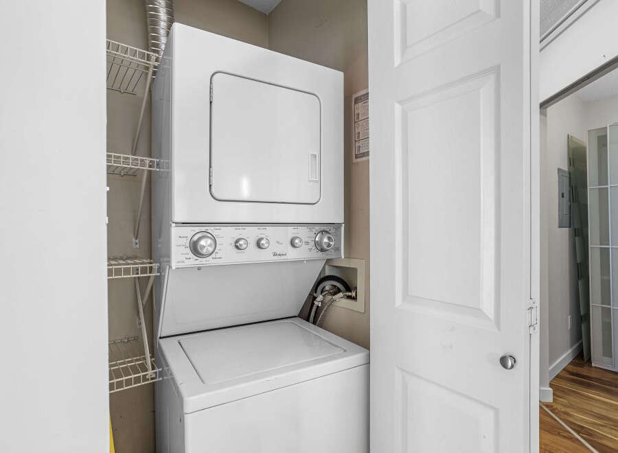 Discover the convenience of in-unit laundry with this stacked Whirlpool washer and dryer.
