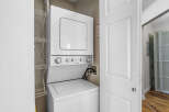 Discover the convenience of in-unit laundry with this stacked Whirlpool washer and dryer.