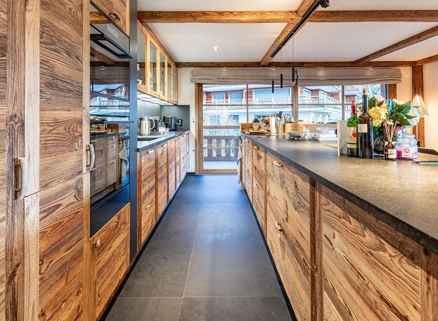 This stunning kitchen boasts a rustic yet modern design, perfect for any home.