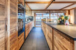 This stunning kitchen boasts a rustic yet modern design, perfect for any home.