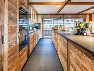 This stunning kitchen boasts a rustic yet modern design, perfect for any home.