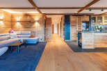 Experience the warmth of this stunning property, featuring exquisite wood paneling and exposed beams throughout.