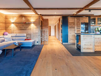 Experience the warmth of this stunning property, featuring exquisite wood paneling and exposed beams throughout.