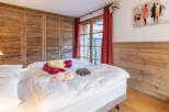 This charming bedroom boasts rustic wooden accents, creating a warm and inviting atmosphere.