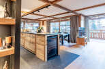 This stunning property boasts a modern kitchen with a wine fridge, perfect for entertaining.