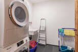 This laundry room offers a functional and organized space for all your washing needs.