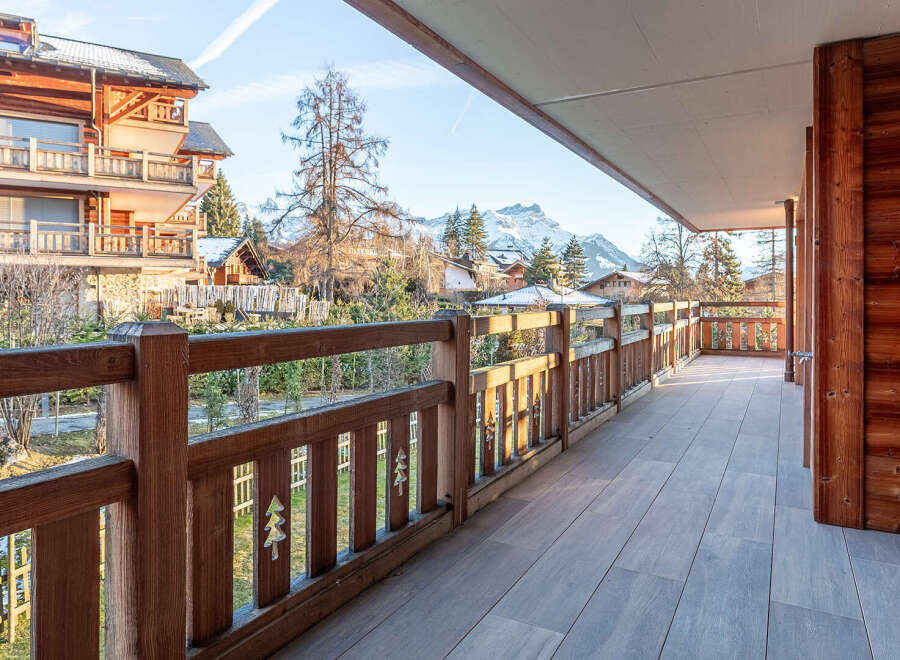 Enjoy breathtaking mountain views from this stunning balcony.