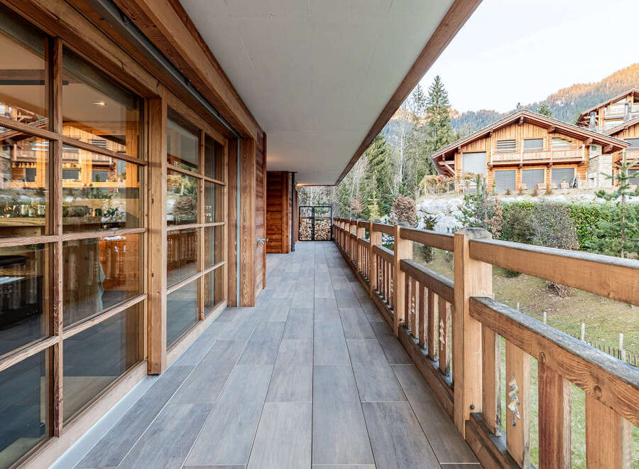 Experience luxury living in this stunning property featuring a spacious balcony with breathtaking mountain views.