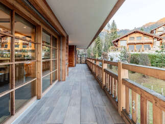 Experience luxury living in this stunning property featuring a spacious balcony with breathtaking mountain views.