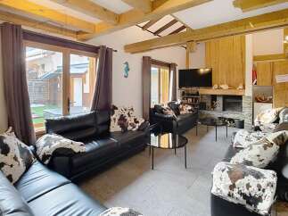 This stunning living room boasts a cozy fireplace, perfect for chilly evenings.