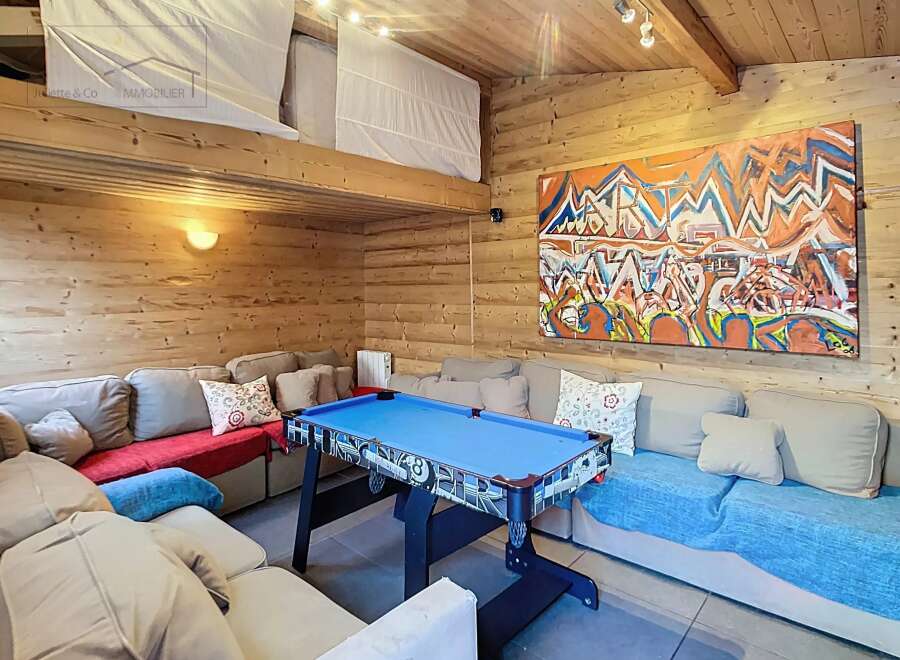 This cozy living space features a unique loft area and is perfect for entertaining.
