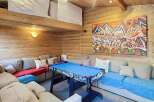 This cozy living space features a unique loft area and is perfect for entertaining.