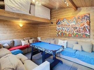 This cozy living space features a unique loft area and is perfect for entertaining.