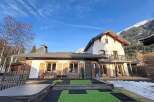 Discover the charm of this stunning property, featuring a beautiful house with wooden shutters and a balcony.
