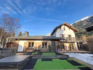 Discover the charm of this stunning property, featuring a beautiful house with wooden shutters and a balcony.