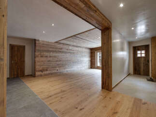 This stunning property boasts a rustic charm with its wooden accents and inviting atmosphere.
