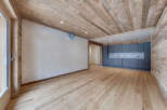 This stunning property boasts a modern interior with a rustic touch, featuring beautiful wooden floors and ceilings.