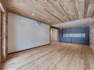 This stunning property boasts a modern interior with a rustic touch, featuring beautiful wooden floors and ceilings.