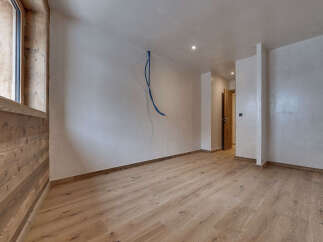 Discover the charm of this inviting space, featuring beautiful wooden floors and a bright, airy atmosphere.