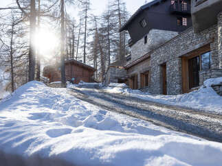 Discover the charm of this stunning mountain property, nestled in a serene winter landscape.