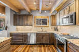 This stunning kitchen boasts a warm and inviting atmosphere, perfect for culinary creations and gatherings.